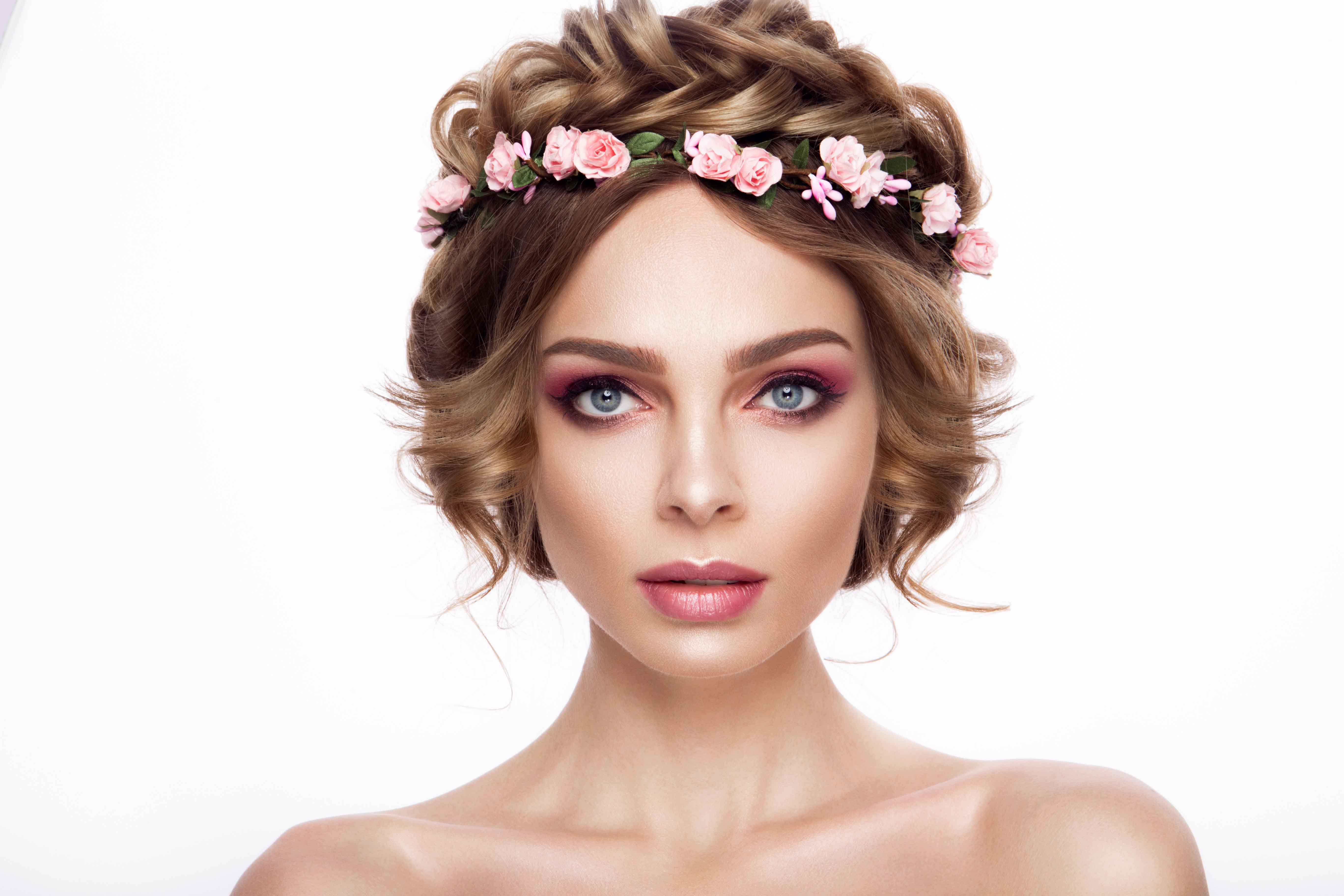 Fashion Beauty Model Girl with Flowers Hair. Bride. Perfect Creative Make up and Hair Style. Hairstyle. Beautiful Flowers
